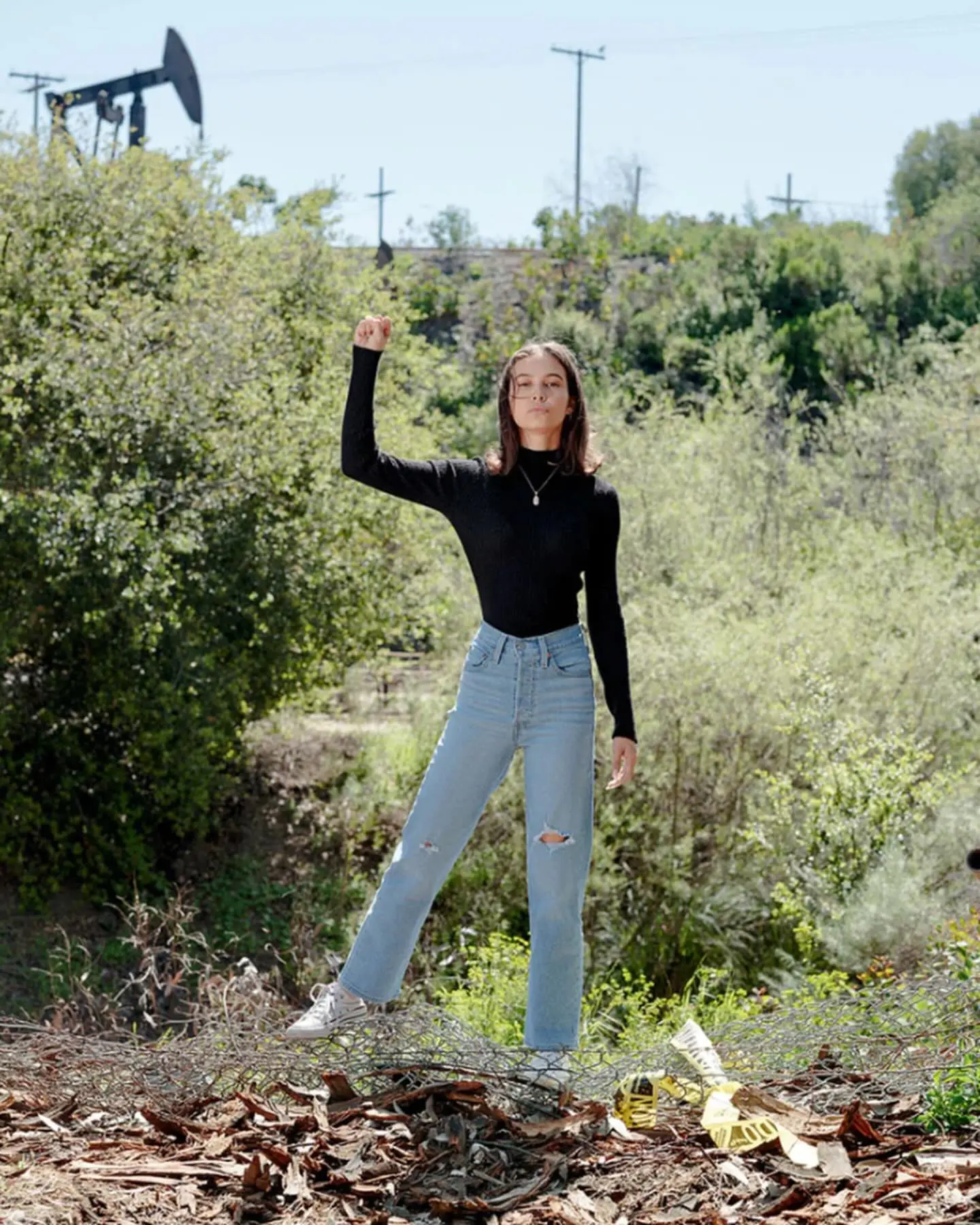 Nalleli Cobo standing with fist raised