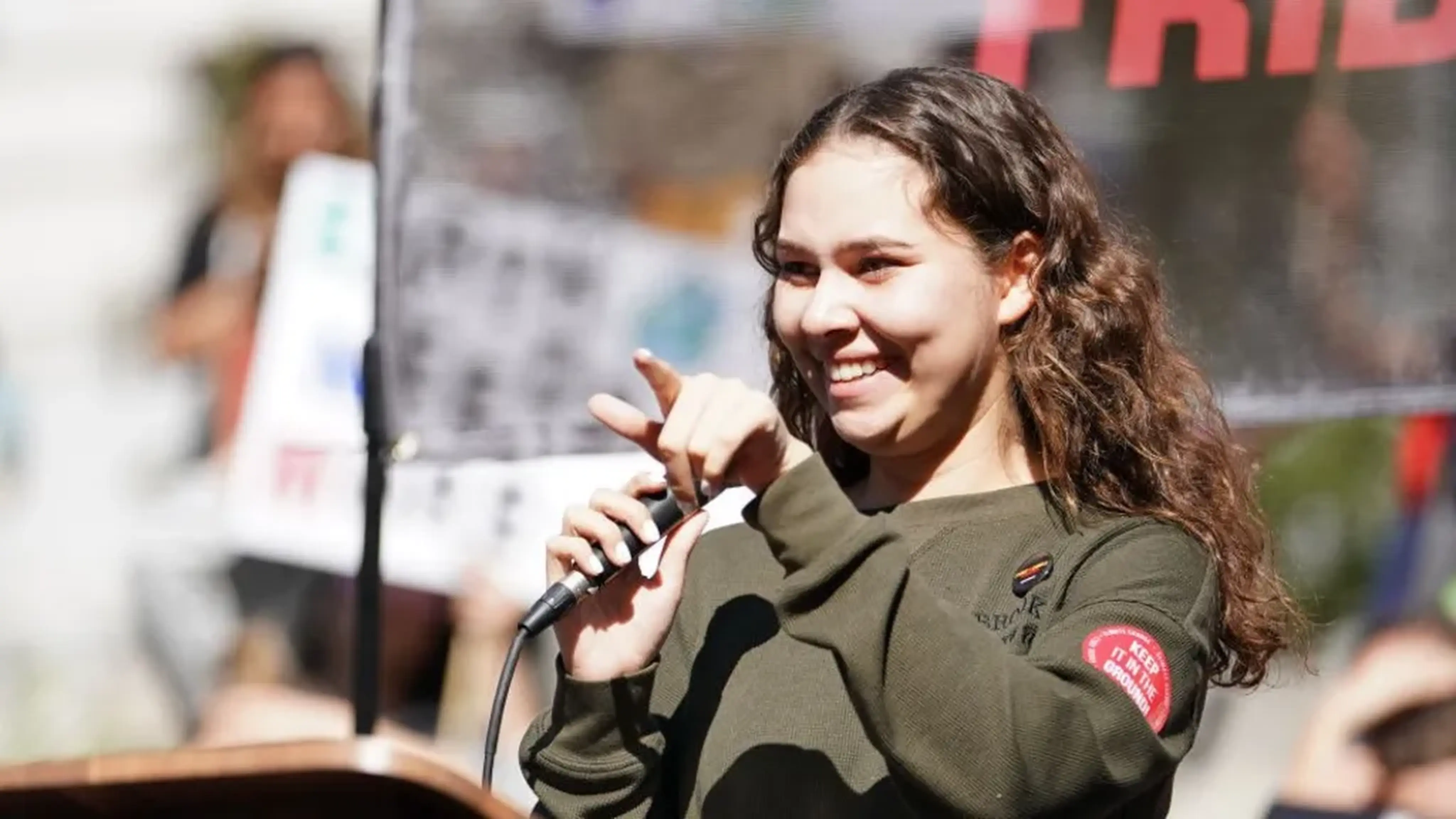 Youth climate activist speaking passionately at rally